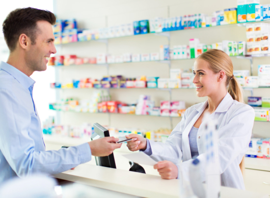 Pharmacist and client at pharmacy